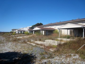Abandoned housing on contaminated soil